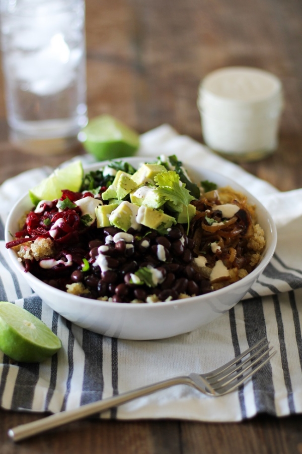 Quinoa, beet, and black bean burrito bowls with caramelized onions and cumin-lime tahini | theroastedroot.net #vegan #vegetarian #recipe #paleo #healthy @roastedroot