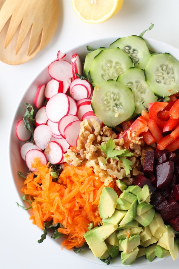 Spring Cleaning Detox Salad with kale, bell pepper, radishes, carrots, beets, avocado, walnuts, and lemon-parsley vinaigrette | theroastedroot.net #vegan #vegetarian #detox #salad #cleaneating #letthemeatkale