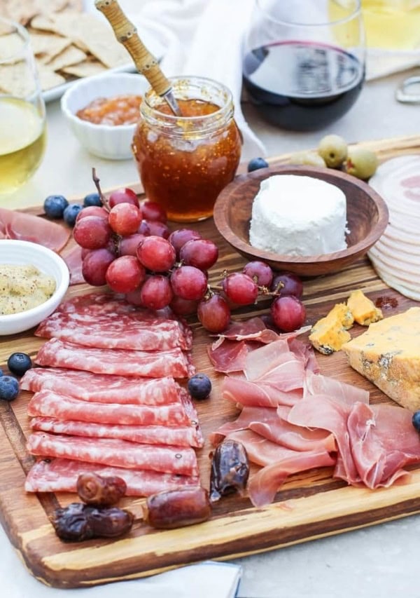 How to Make a Charcuterie Board - tips for selecting meat, wine and cheese pairings, as well as incorporating seasonal ingredients