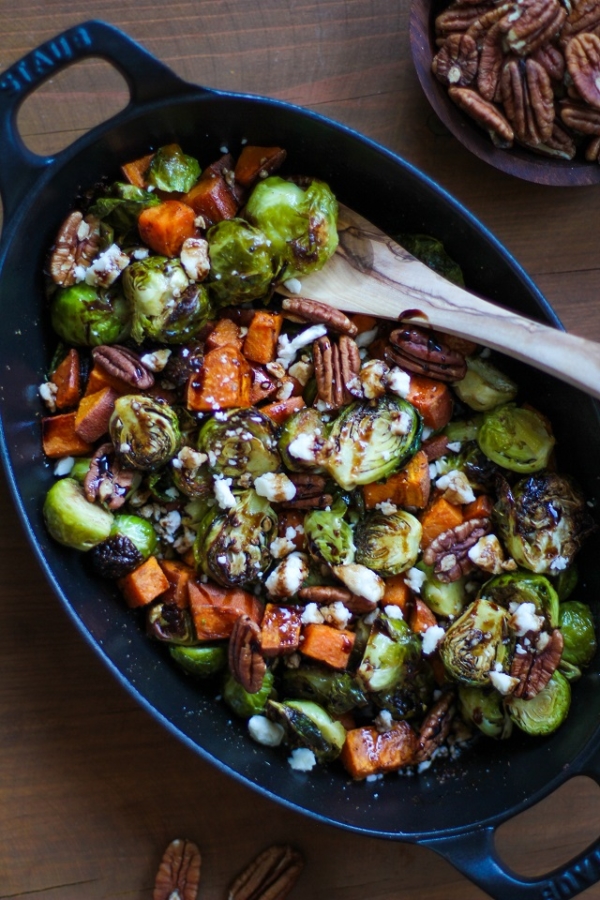Roasted Brussels Sprouts and Sweet Potatoes with Pecans, Feta, and Balsamic Reduction | TheRoastedRoot.net #healthy #vegetarian