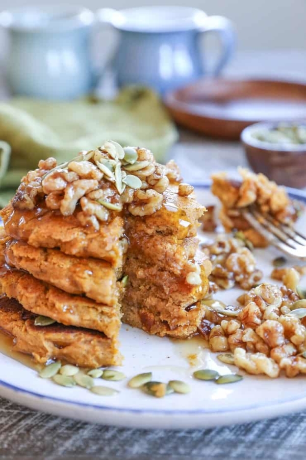 Vegan Pumpkin Pancakes with Maple-Toasted Walnuts and Pumpkin Seeds. You'd never know these pancakes are gluten-free and vegan!