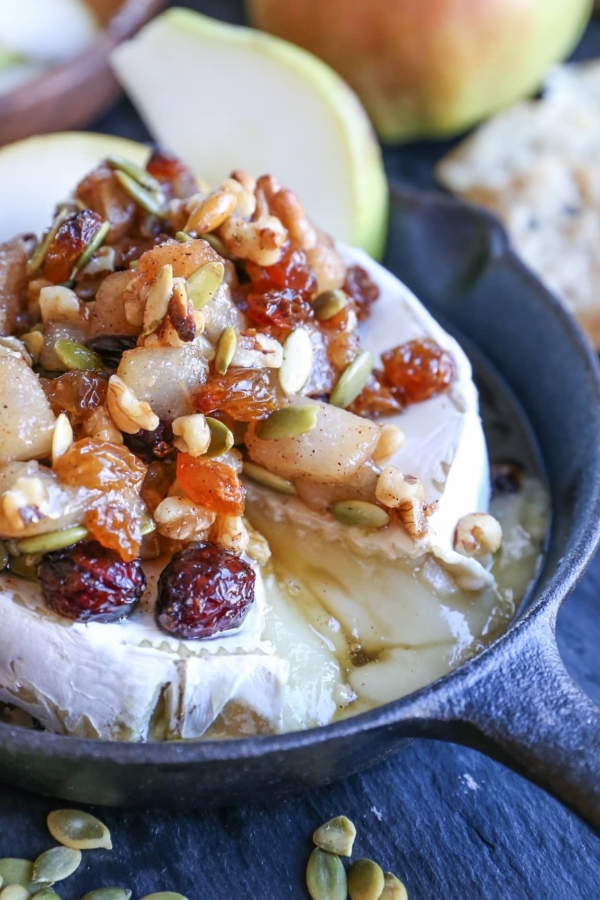 Maple-Spiced Pear Baked Brie with Walnuts, Pumpkin Seeds, and Golden Raisins - a lovely fall-inspired appetizer