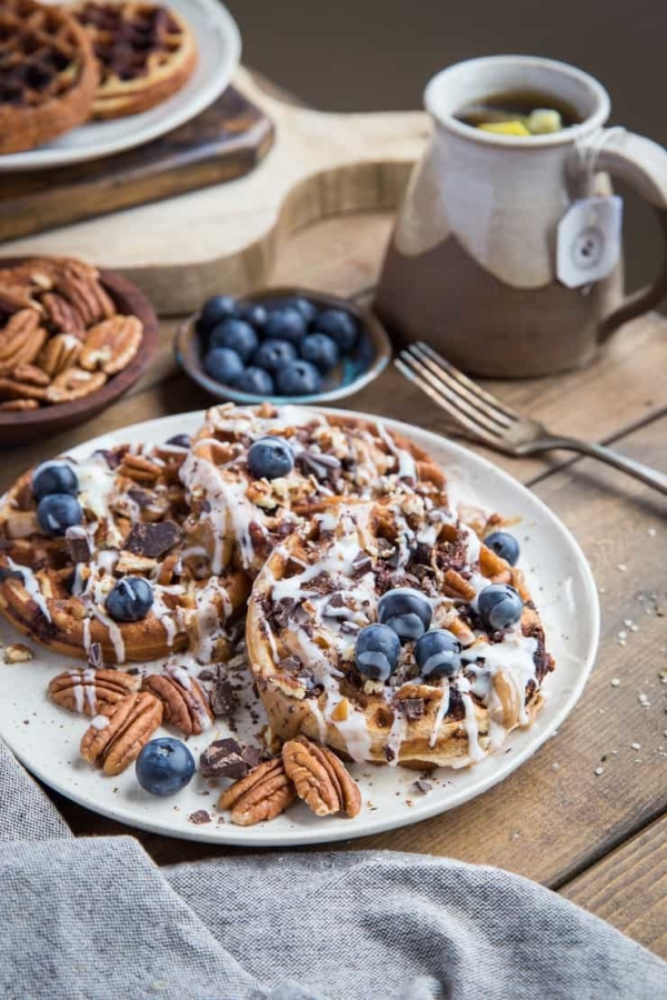 Paleo Chocolate Pecan Waffles with almond butter, coconut butter, and blueberries. This grain-free waffle recipe is prepared in your blender and tastes magnificent!