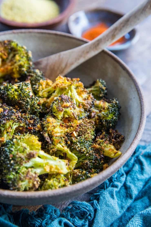 "Cheesy" Vegan Roasted Broccoli - a vegan approach to cheesy broccoli using nutritional yeast in place of cheese | TheRoastedRoot.com