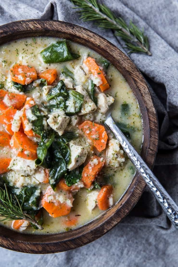 Top down photo chicken soup with rice and spinach