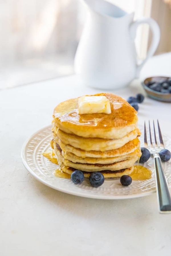 Paleo vegan pancakes that are grain-free, dairy-free, and made with almond flour. This healthy gluten-free pancake recipe is made easily in your blender and results in fluffy, moist pancakes.