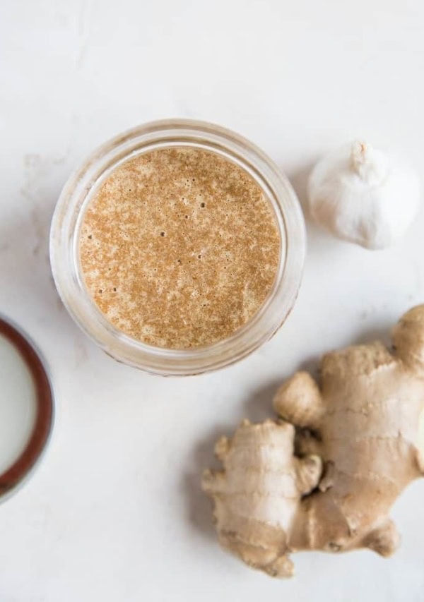 Top down photo of easy stir fry sauce with ginger and garlic next to the jar