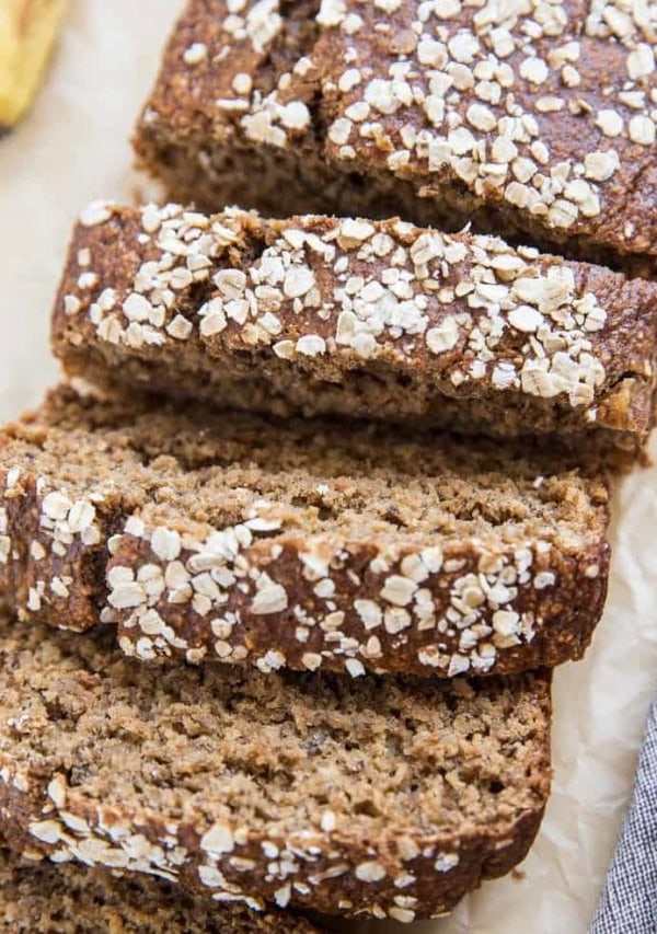 Loaf of dairy-free gluten-free oatmeal banana bread with slices cut