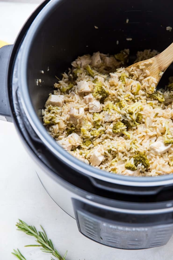 Perssure cooker with Rosemary Lemon Instant Pot Chicken and Rice in it