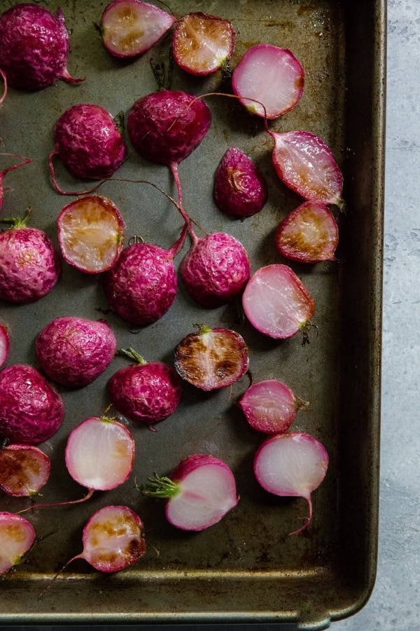 Roasted radishes on a baking sheet