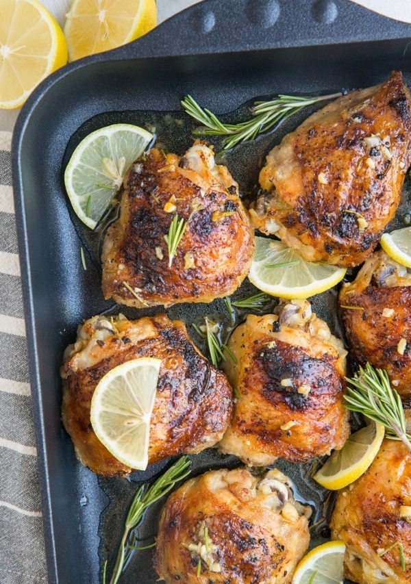 Easy Baked Garlic Lemon Rosemary Chicken - fall-off-the-bone tender delicious chicken thighs with perfect crispy skin - a simple yet magnificently flavorful dinner