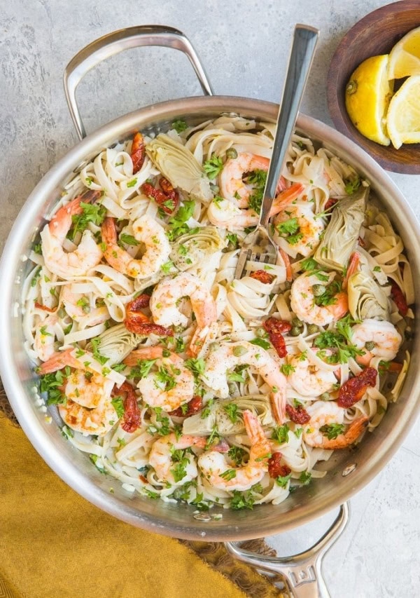 Easy Gluten-Free Mediterranean Shrimp Pasta with sun-dried tomatoes, artichoke hearts and capers in a lemon garlic cream sauce (that happens to be dairy-free)