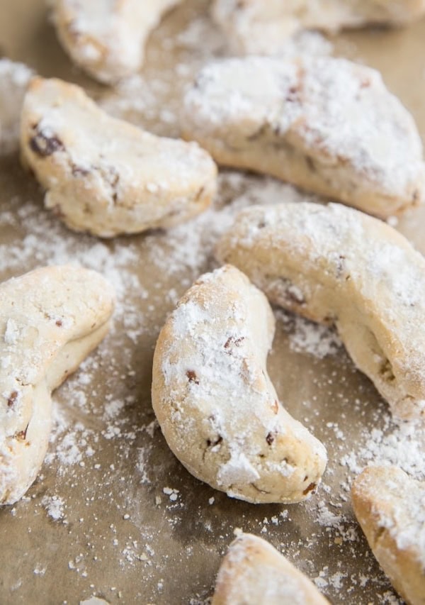 Paleo Mexican Wedding Cookies are egg-free, grain-free, refined sugar-free and can easily be made vegan. These festive cookies are marvelous additions to any holiday gathering or cookie exchange.