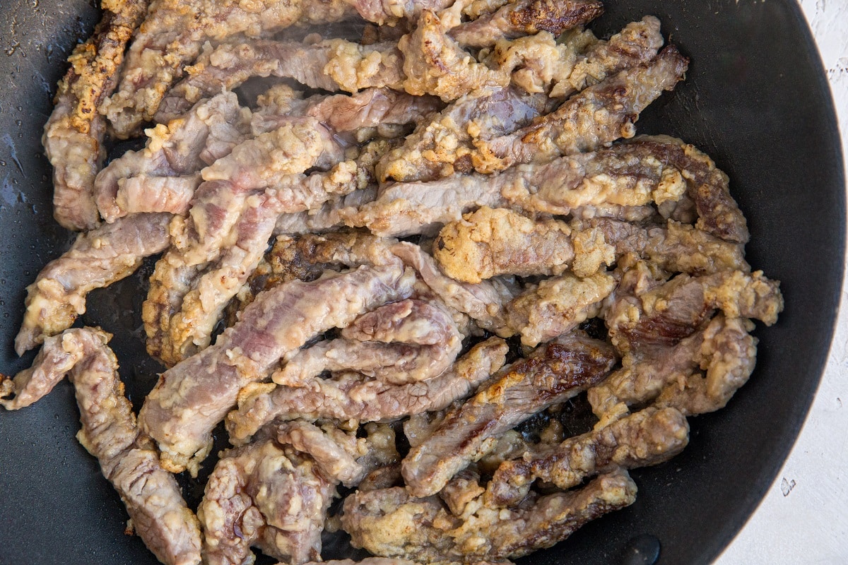 Beef in a skillet browning