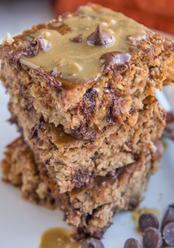 Close up photo of a stack of three slices of peanut butter banana baked oatmeal