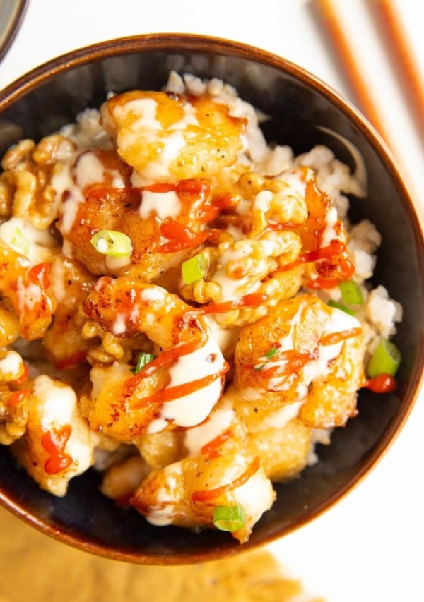 Bowl of Honey Walnut Shrimp with green onions on top