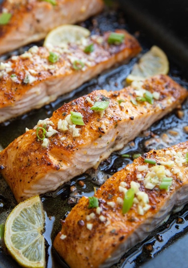 big roasting pan with finished garlic butter baked salmon