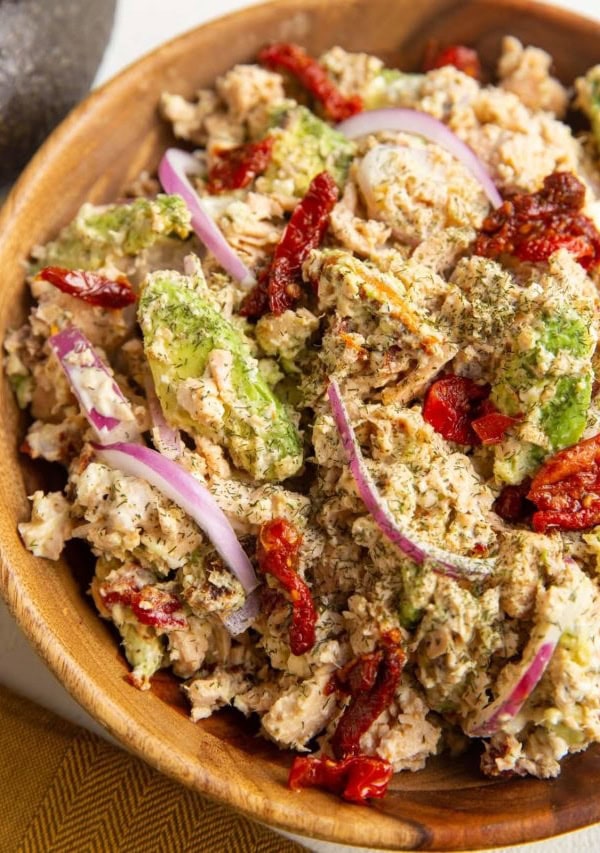 Wooden bowl of Mediterranean salmon salad