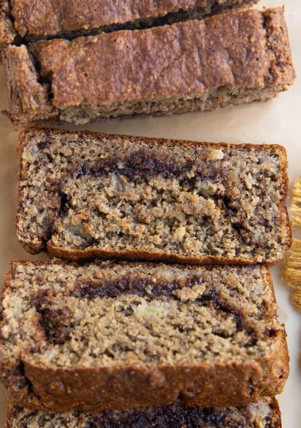 Sliced loaf of cinnamon swirl banana bread.