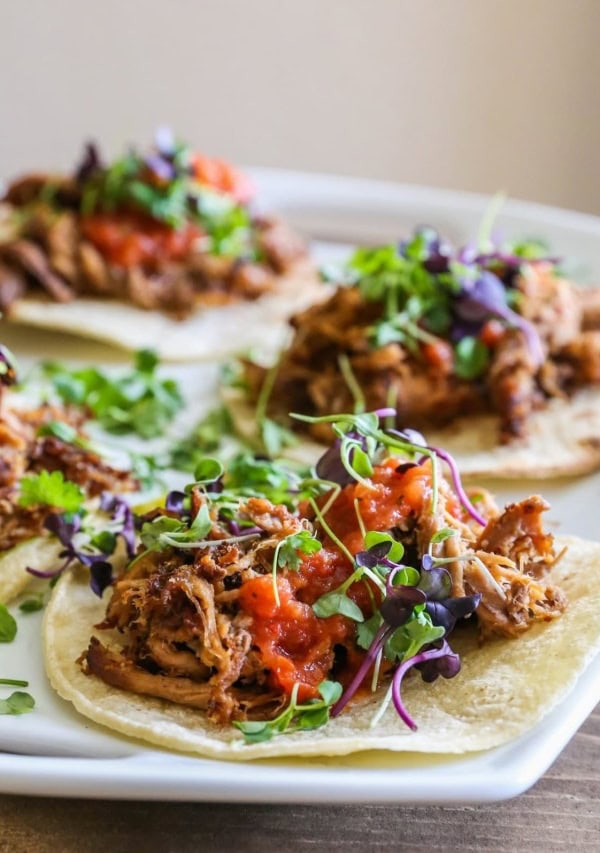 Barbacoa beef tacos on a serving platter