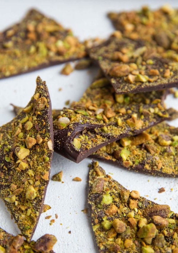 Pistachio Bark chunks laying on a white background.