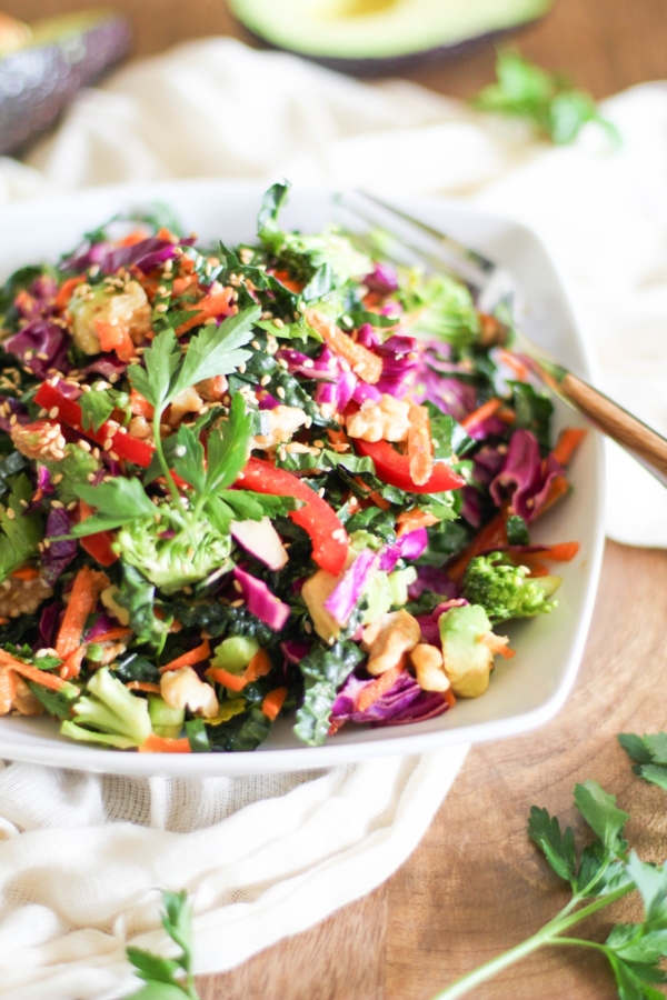 The Ultimate Detox Salad with Lemon-Parsley Dressing in a white bowl, ready to eat.