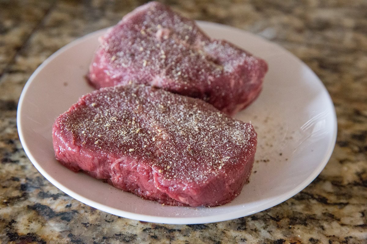 Sprinkle filet mignon with sea salt, garlic powder, and black pepper