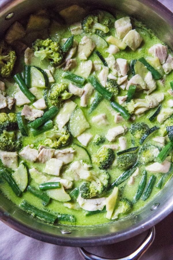 stainless steel skillet of fish green curry ready to serve.