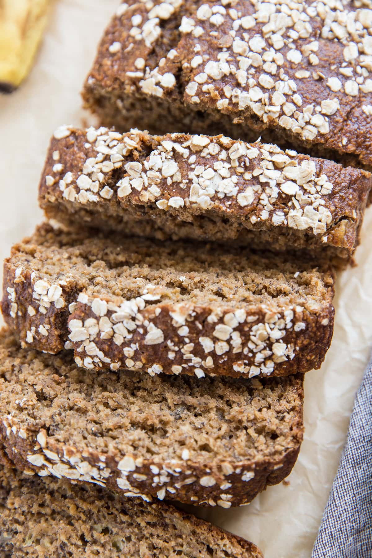 Loaf of dairy-free gluten-free oatmeal banana bread with slices cut