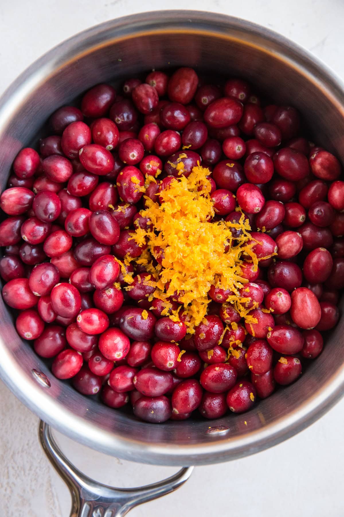 Cranberry sauce ingredients in a saucepan, ready to heat up