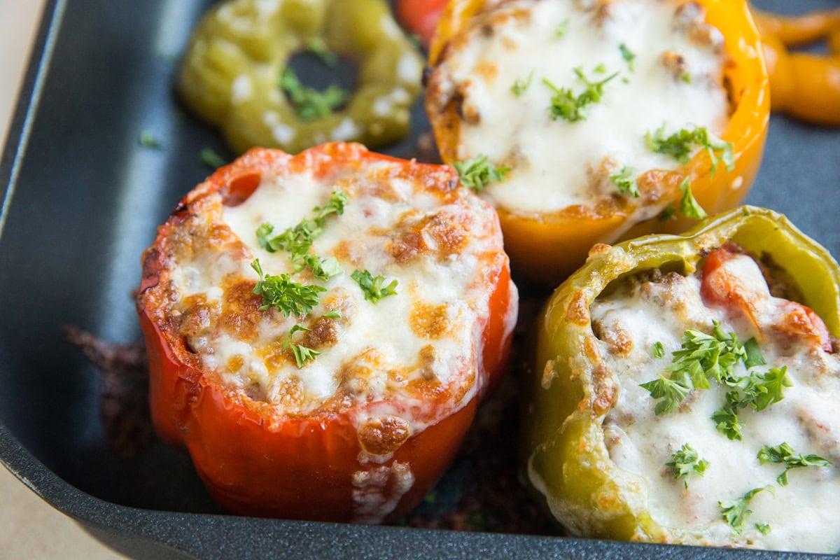 Baking dish full of stuffed bell peppers, fresh out of the oven.