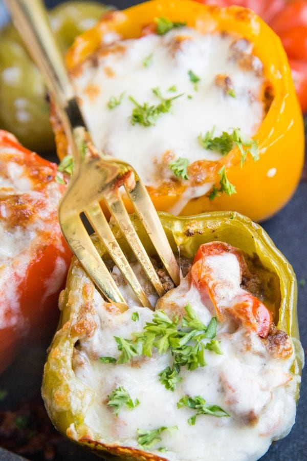 Stuffed bell pepper with a fork sticking in to take a bite.