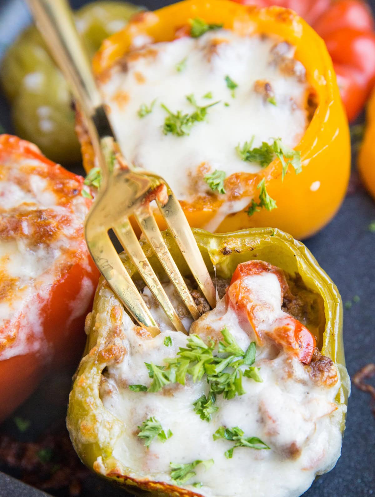 Stuffed bell pepper with a fork sticking in to take a bite.