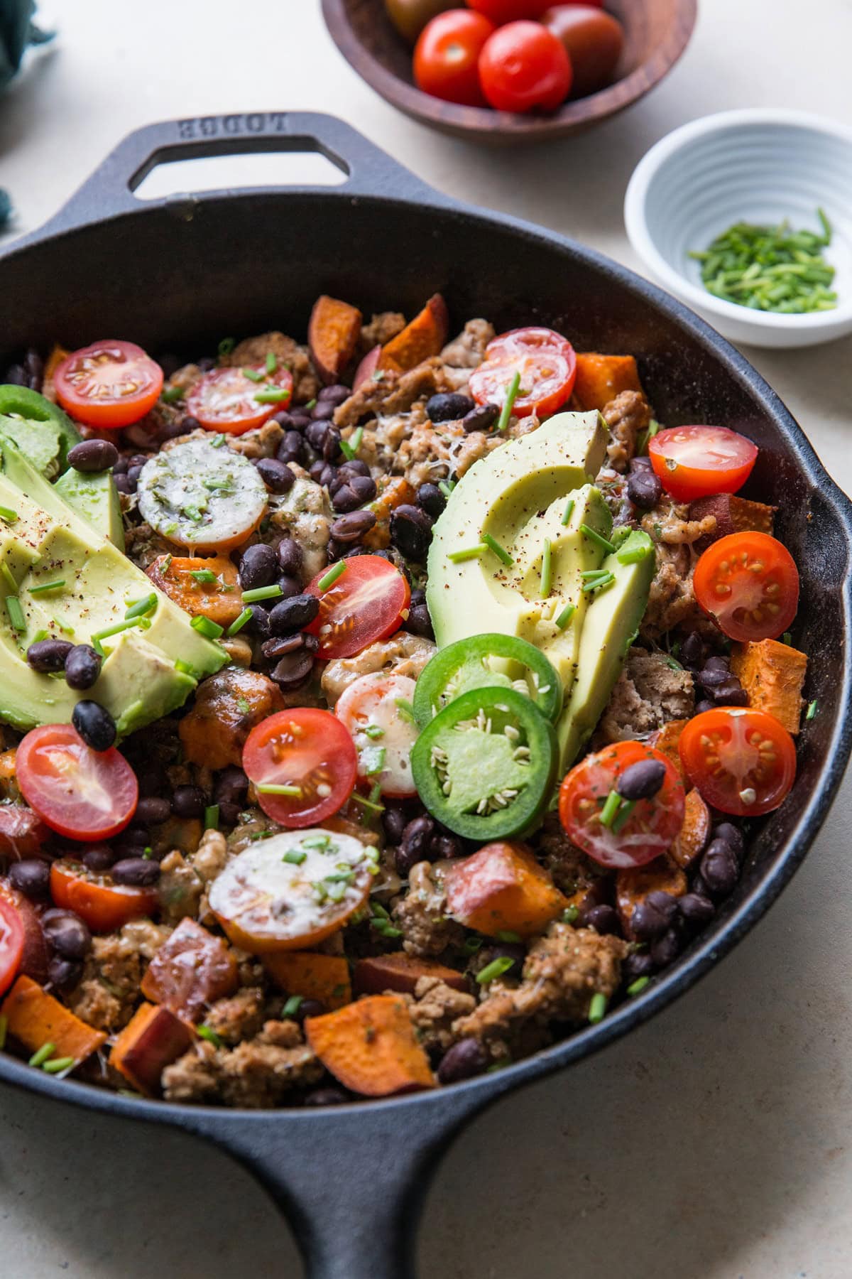 Ground Turkey Taco Skillet with sweet potato, black beans, tomatoes, and avocado - a healthy 30-minute meal! | TheRoastedRoot.net