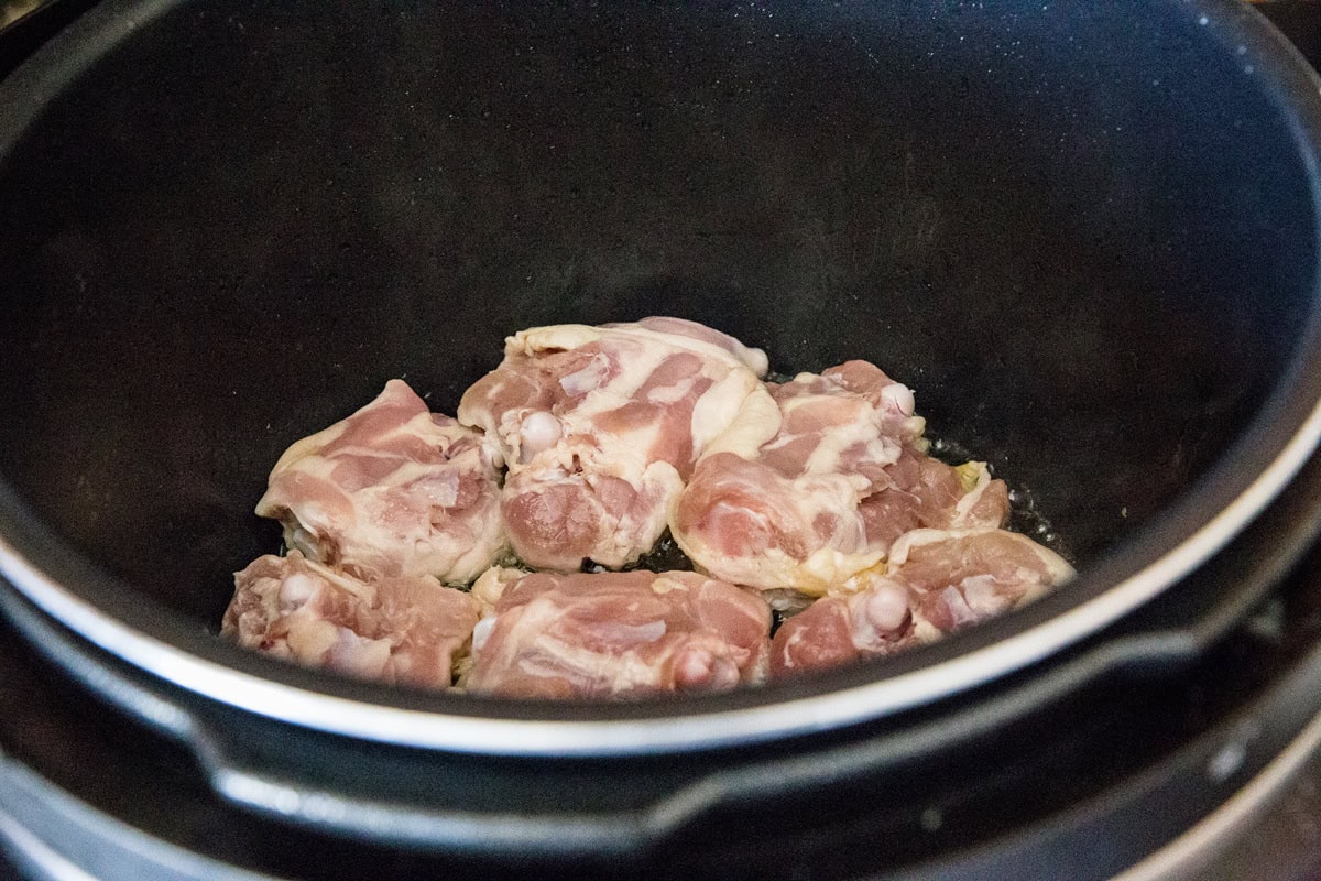 Sear the chicken thighs in the Instant Pot