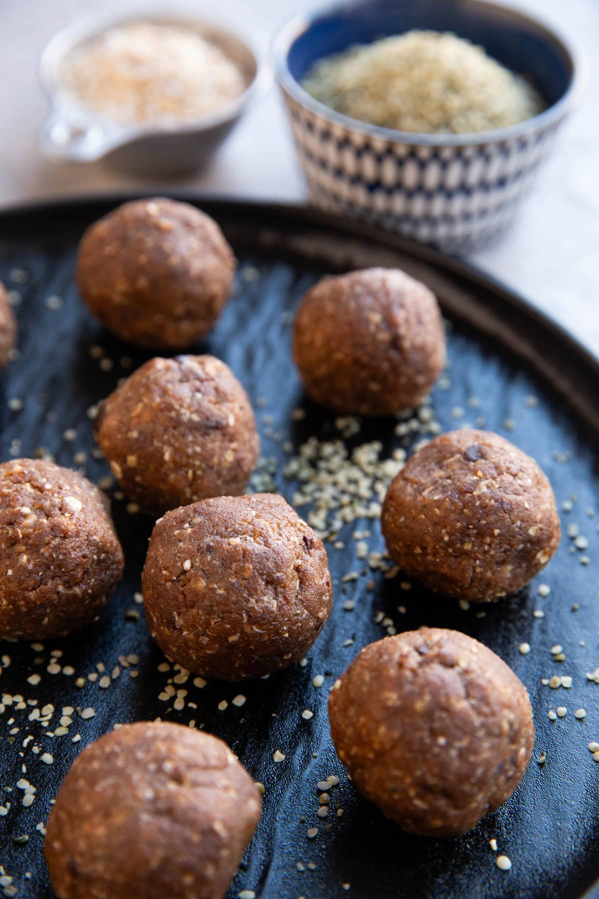 Plate of power balls, sprinkled with hemp seeds. Ready to eat!