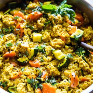 Large stainless steel skillet full of Thai ground turkey curry.