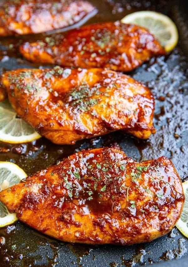 Sesame Garlic Ginger Baked Chicken Breasts in a baking dish fresh out of the oven.