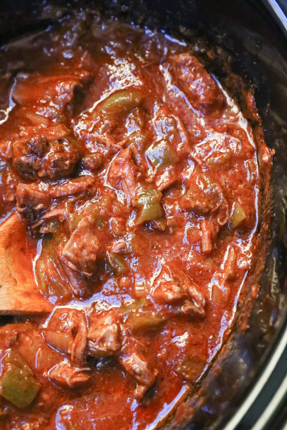 slow cooker full of Cuban shredded beef ready to use