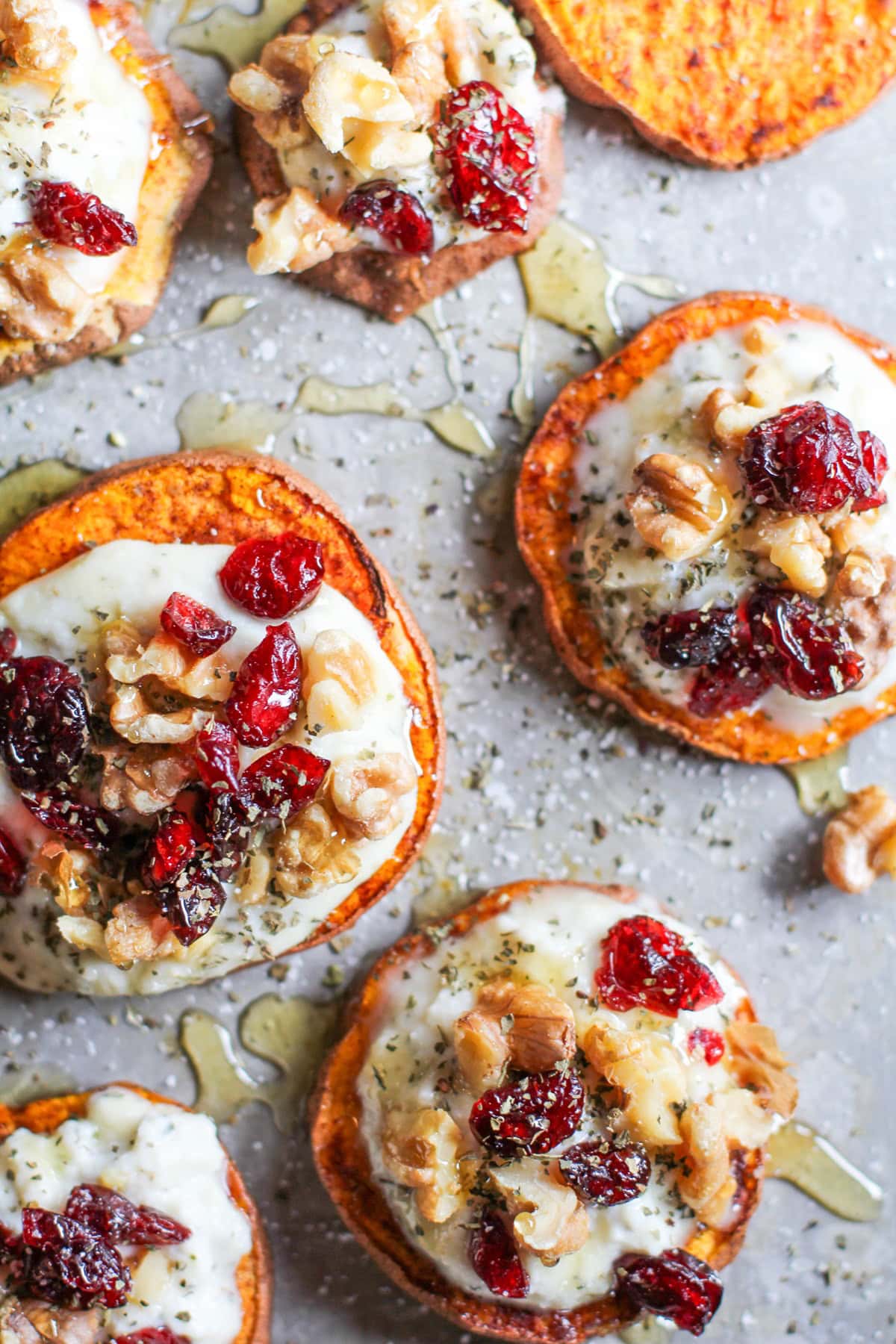 Sweet Potato Rounds with Herbed Goat Cheese, Roasted Walnuts, Cranberries, and Honey | TheRoastedRoot.net an easy and healthy appetizer! #recipe #glutenfree #healthy #holiday