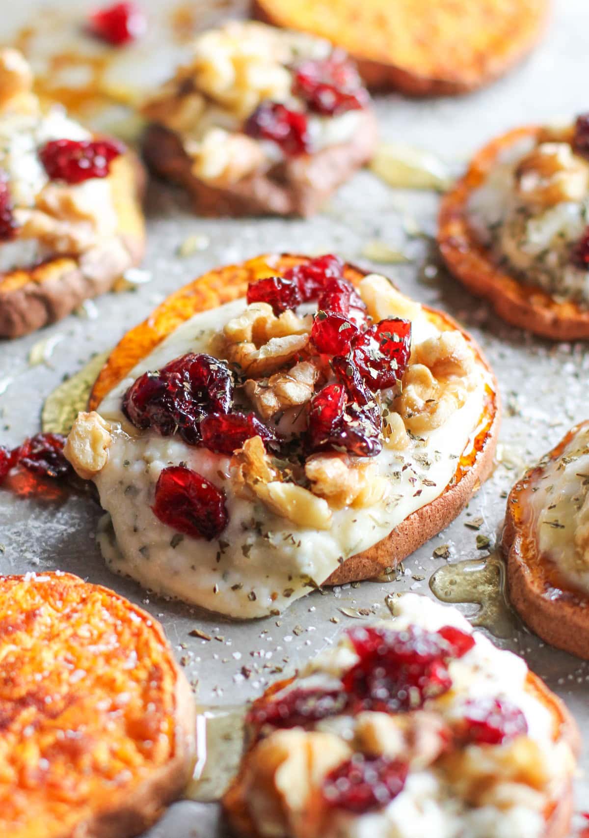 Roasted Sweet Potato Rounds with Herbed Ricotta, Dried Cranberries, Walnuts, and Honey - an easy, healthy festive appetizer!