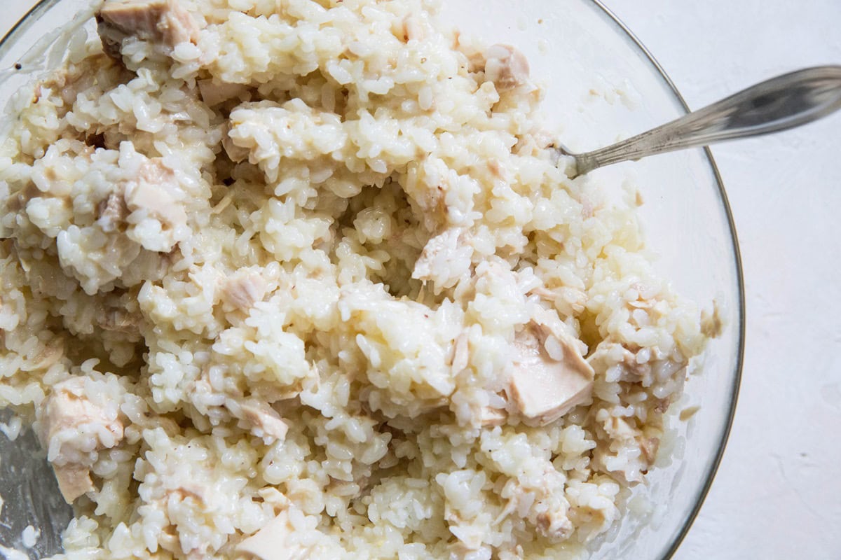 Glass bowl full of tuna and rice mixture to make tuna casserole.