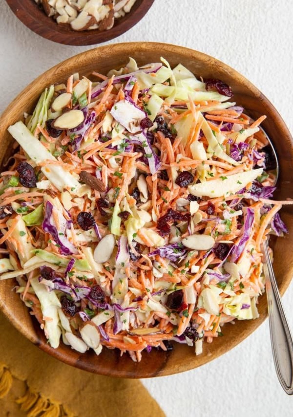 Carrot coleslaw in a large bowl ready to serve.