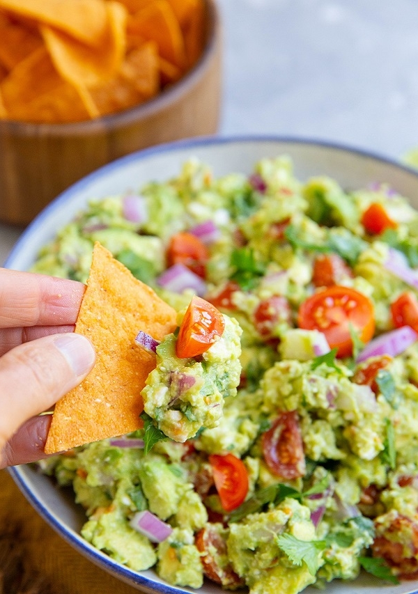 blue rimmed bowl of feta avocado dip