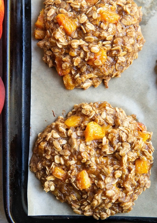 peach oatmeal cookies on a cookie sheet