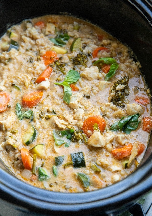 slow cooker full of Thai curry with chicken and vegetables.