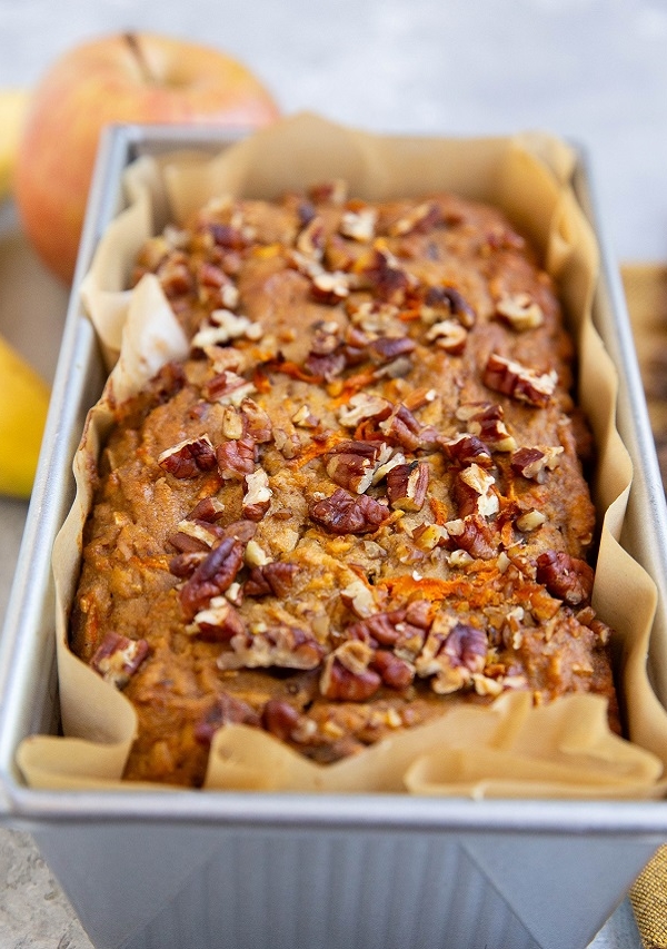 Loaf pan with morning glory bread fresh out of the oven.