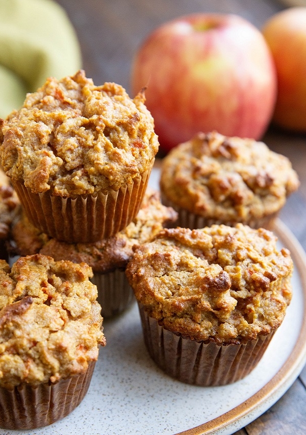 Pile of apple carrot muffins on a plate