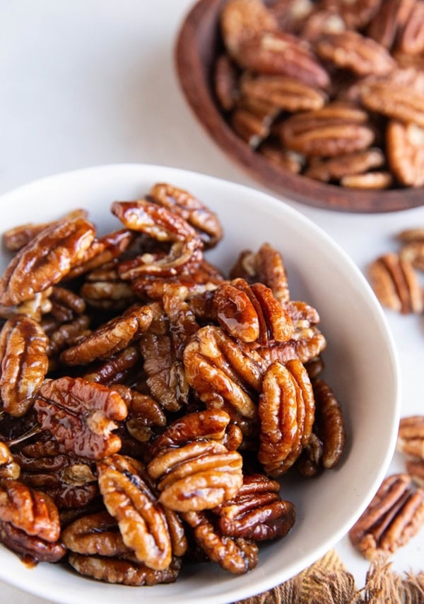 Bowl full of candied pecans.