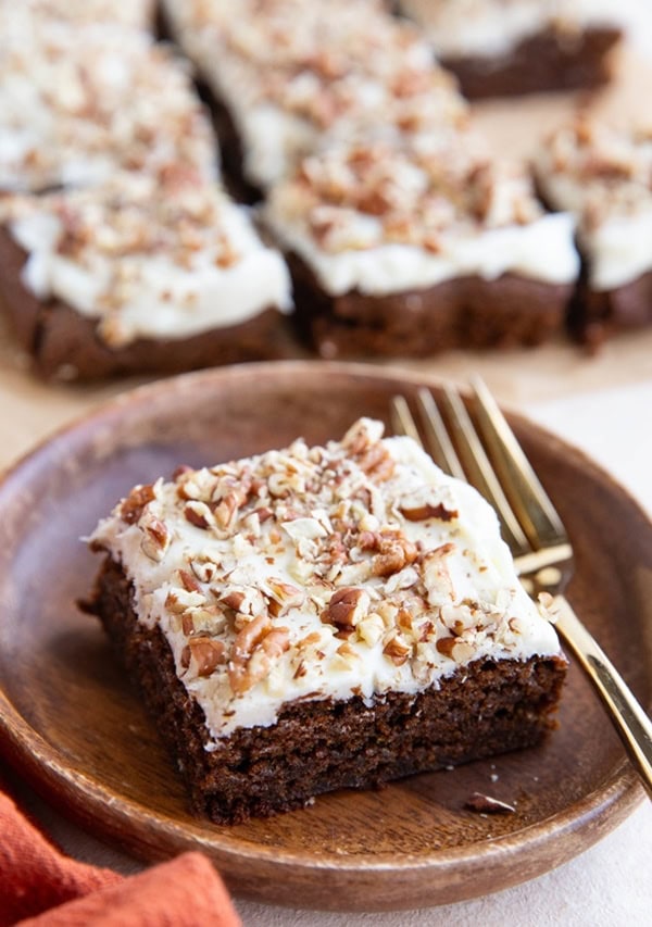 slice of gingerbread cake on a wooden plate